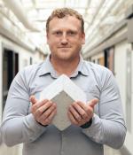 “Roman concrete to me is fascinating: It’s still standing after all this time and constantly repairing,” Admir Masic says, pictured here holding a Roman-inspired, self-healing concrete cube. 